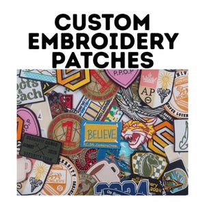 May include: A collection of custom embroidered patches in various shapes and colors. The patches feature text, logos, and illustrations, including the word "BELIEVE" and the text "CUSTOM EMBROIDERY PATCHES".