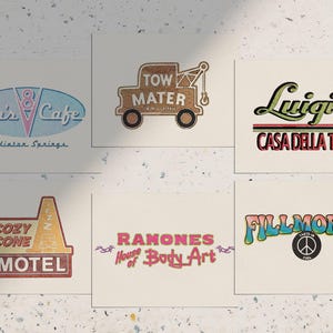May include: Six square cards displaying vintage-style logos. The logos read "Flo's Cafe", "Tow Mater", "Luigi's Casa Della Tires", "Cozy Cone Motel", "Ramones House of Body Art", and "Fillmore's". The colour scheme is retro, using pastel and earthy tones.