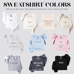 Op de afbeelding: Een grafiek met 10 verschillende kleuren sweatshirts met de namen van elke kleur en de beschikbare maten voor elke kleur. De kleuren omvatten wit, cr&egrave;me, asgrijs, lichtblauw, roze, sportgrijs, donker grijs melange, zwart, zand en heide naturel.