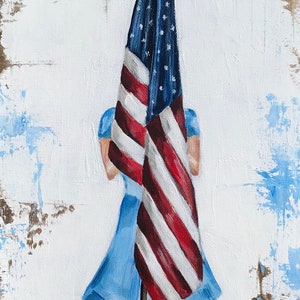 May include: A painting of a person in a blue dress holding an American flag in front of them. The flag is red, white, and blue and is folded in half. The background is a white canvas with brown and blue paint splatters.