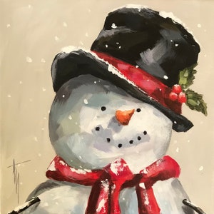 May include: A snowman wearing a black top hat with a red band and a red scarf. The snowman has a carrot nose and black eyes.