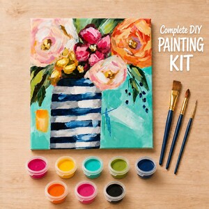 May include: A complete DIY painting kit featuring a canvas with a floral arrangement in a blue and white striped vase against a teal background. The text reads Complete DIY PAINTING KIT. Includes three paintbrushes and nine small paint pots.