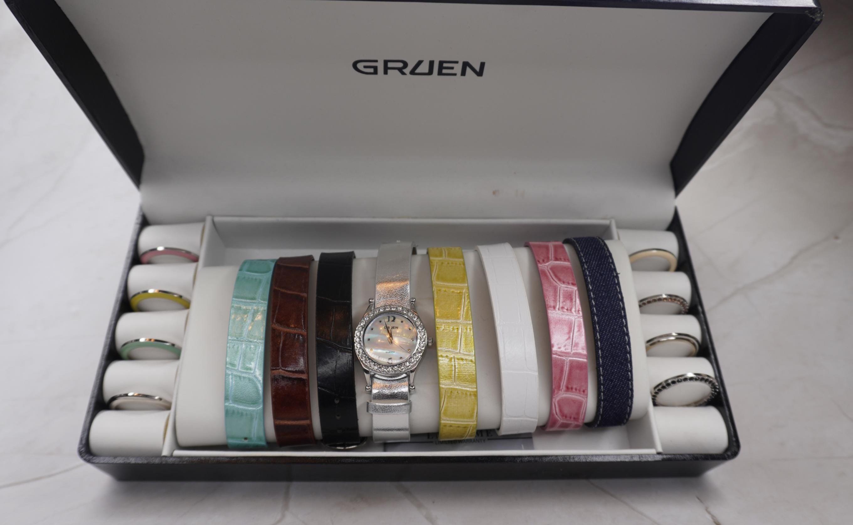 Gruen Watch with Interchangeable Color Bezels and Mother of Pearl dial. GRUEN, Quartz, Mother of Pearl Dial, CZ Bezel Blue Leather  main image 2