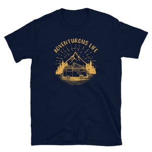 May include: Navy blue t-shirt with a yellow graphic of a vintage van driving through a mountain landscape. The text "Adventurous Life" is above the van.