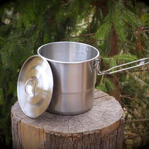 May include: A rustic wooden sign with the text "Welcome to our home" in white lettering. The sign features a distressed finish and a simple, inviting design, perfect for front door decor.