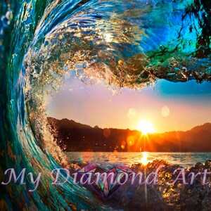 May include: A large wave breaks over a calm ocean at sunset, creating a colourful, abstract pattern of blue, green, and gold. The sun is setting behind a mountain range in the distance. The text "My Diamond Art" is visible in the lower right corner of the image.