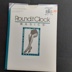 May include: A package of Round the Clock Basics pantyhose in ivory. The package features a woman wearing the pantyhose and the text "Comfort Lite Control" and "Extended Size Range".