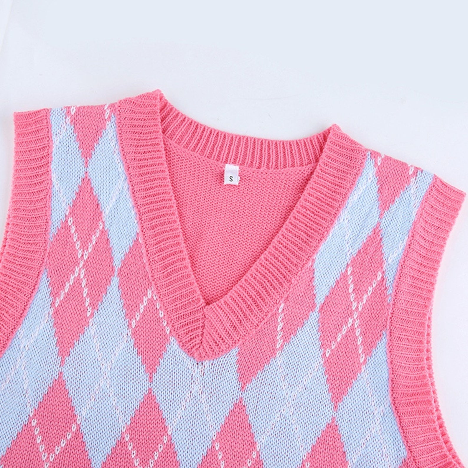 pink v neck sweater vest