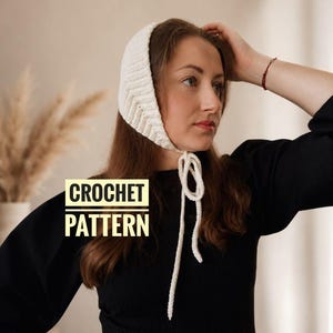 May include: A cream-colored crochet bonnet with a chevron pattern and tie closure. The text "CROCHET PATTERN" is displayed in a white and gold box. The bonnet is a handmade item.