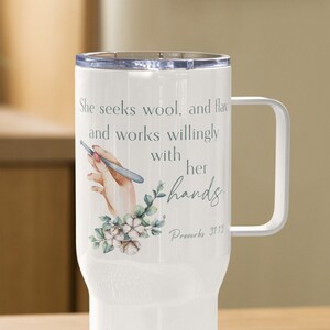 May include: White stainless steel tumbler with a floral design and the quote "She seeks wool, and flax and works willingly with her hands. Proverbs 31:13"