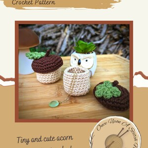 May include: Crocheted acorn-shaped storage containers in brown and beige with green leaves. The containers are perfect for storing small items like jewelry. The image also includes the text "Mini Acorn Storage Crochet Pattern" and "Tiny and cute acorn storage for jewelry!" along with a logo for "Once Upon A Stitch Nook".