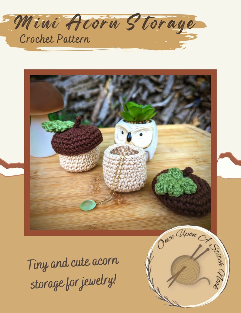 May include: Crocheted acorn-shaped storage containers in brown and beige with green leaves. The containers are perfect for storing small items like jewelry. The image also includes the text "Mini Acorn Storage Crochet Pattern" and "Tiny and cute acorn storage for jewelry!" along with a logo for "Once Upon A Stitch Nook".