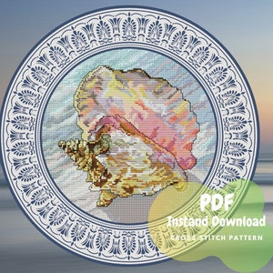 May include: A cross stitch pattern featuring a colourful seashell in a blue and white decorative frame. The pattern is available as a PDF instant download. PDF Instant Download Cross Stitch Pattern