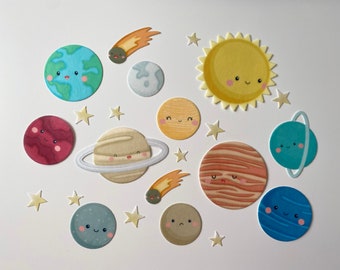May include: A collection of colorful, cartoon-style planets, stars, and a comet on a white background. The planets include Earth, Mars, Saturn, Jupiter, Uranus, and Neptune, each with smiling faces. The sun and moon are also featured.
