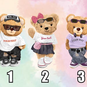 May include: Three cartoon teddy bears wearing sunglasses and stylish outfits. One bear wears a cap and ripped jeans, another a skirt and pink bow, and the third a purple shirt and headphones. Each shirt has the text "YOUR TEXT".