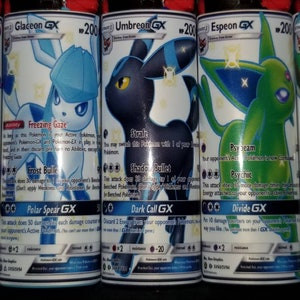 May include: Five Pokemon trading cards featuring different Eeveelutions. The cards are all holographic and feature the Pokemon's name and attack moves. The cards are all in good condition.