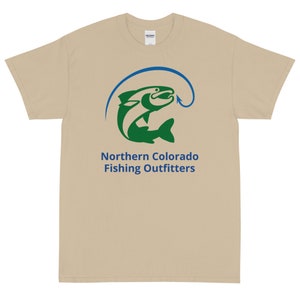 May include: A tan t-shirt with a green fish jumping out of the water with a blue fishing hook. The text "Northern Colorado Fishing Outfitters" is printed below the fish.
