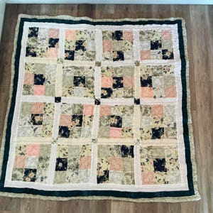 Large double patchwork quilt using mainly Laura Ashley fabrics in navy greens and pinks