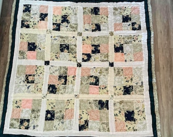 Large double patchwork quilt using mainly Laura Ashley fabrics in navy greens and pinks