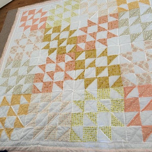 Large double  patchwork quilt in peach  and mustards. Hand quilted