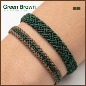 May include: Two macrame bracelets in green and brown are shown. The top bracelet is solid green, the bottom is brown with a green centre. The text "Green Brown Mix and Match Set" is at the top.