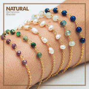 May include: Several natural gemstone bracelets with gold chains are displayed. The bracelets feature various colored beads, including purple, green, white, and blue. The text "NATURAL Gemstones Bracelet" is in the upper left corner.