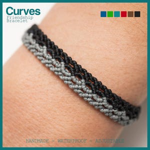 May include: A black and gray friendship bracelet with the text "Curves Friendship Bracelet" and "Handmade - Waterproof - Adjustable".