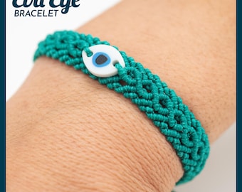 May include: A teal macrame bracelet with an evil eye charm. The bracelet features a woven design and a white charm with a blue and black eye symbol. The words "Evil Eye Bracelet" are in the upper left corner.