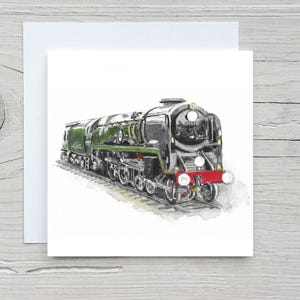 May include: Watercolor illustration of a black and green steam locomotive on a white background. The train has red accents and is positioned on a section of railroad tracks. The image is on a white card.
