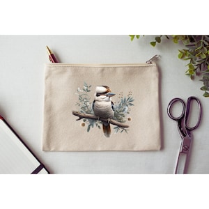 May include: A beige canvas zippered pouch featuring a colourful illustration of a kookaburra bird perched on a branch with green leaves and white flowers.