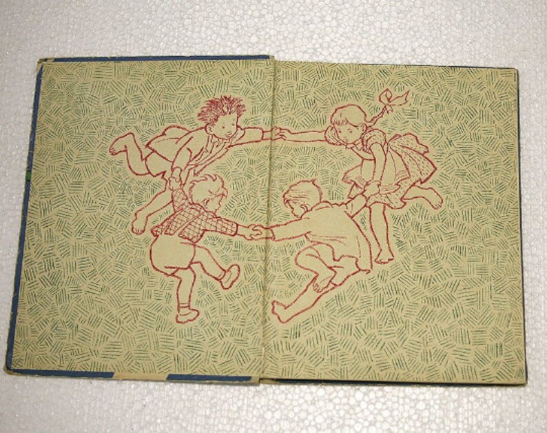 May include: An illustration of four children holding hands and forming a circle. The children are drawn in a simple style with red outlines and are on a background of green and red lines.