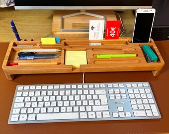 Desk organizer with pen, cell phone and notepad holder over PC keyboard