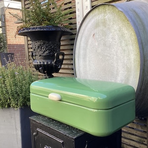 Enamel bread bin with white bakelite handle