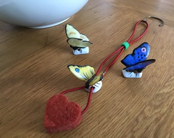 Special Butterfly Halfdoll - German porcelain butterfly with red felt heart as drop catcher - made between 1930 / 1950