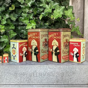 Droste Cocoa Powder tins from various time periods - released by the well-known Dutch cocoa/chocolate brand Droste, in Haarlem