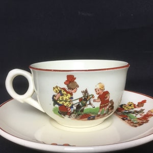 Children's tableware, Cup and Saucer, Société Ceramique Maastricht Ca. 1950s children with toys and animals, very rare