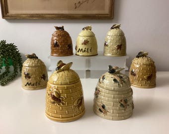 Honey pot in various colours and designs - bees decorate these vintage earthenware honey pots - nice and decorative on the breakfast table
