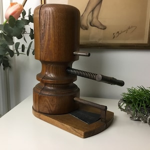 Oak hat stretcher - decorative and functional for the hatter and hat shop - made around 1920 with original size chart