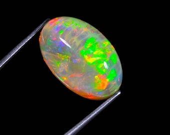 宝石ルース 『魅力的な全面の彩りの斑（ふ）』エチオピア産天然オパール2.619ソ 天然ブラックオパール 12.00カラット エチオピア産 鑑定書付きルース