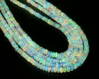 May include: A multi-strand necklace made of iridescent opal beads. The beads are round and have a smooth, polished finish. The necklace is a beautiful and elegant piece of jewelry.