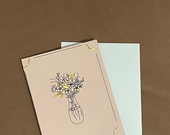 Handmade pink greeting card flower design with gold accents