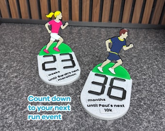 May include: Two running-themed countdown timers. One shows "23 weeks until Sarah's next marathon" with a runner figure. The other shows "36 months until Paul's next 10K" with a runner figure. The text "Count down to your next run event" is also visible.
