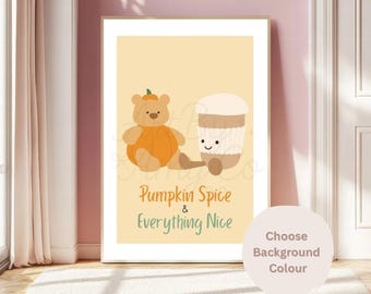 May include: A rectangular wall art print on a light yellow background featuring a tan teddy bear wearing an orange pumpkin costume next to a smiling coffee cup. The text reads Pumpkin Spice & Everything Nice in orange and green lettering.