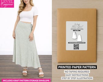 May include: A woman wearing a white crop top and a long, light green floral skirt. Next to her is a brown paper pattern envelope with a label that reads "Wrap Maxi Skirt Sewing Pattern." The envelope also states "Printed Paper Pattern" and "No Taping Required."