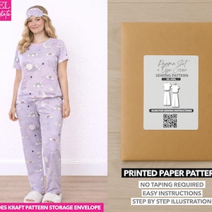 May include: A woman wearing a lavender pajama set with a cloud and star pattern, matching eye mask, and slippers. A brown paper pattern envelope with a label that reads "Pajama Set + Eye Cover Sewing Pattern" is also shown. The text "Printed Paper Pattern" is visible.