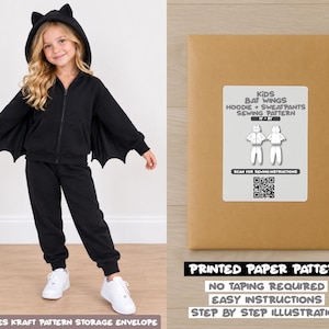 May include: A black zip-up hoodie with bat wings and matching sweatpants, alongside a brown kraft paper envelope containing a printed sewing pattern for kids' bat wing hoodie and sweatpants, featuring a QR code for instructions.