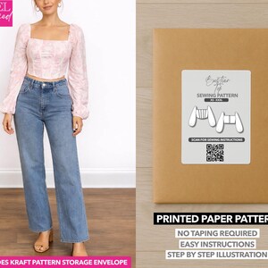 May include: A woman wearing a pink floral top and blue jeans. Next to her is a brown paper package with a white label that says "Bustier Top Sewing Pattern". The package also says "Printed Paper Pattern" and "No Taping Required".