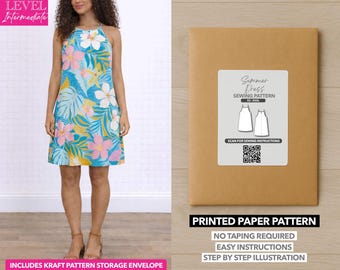 May include: A woman wearing a turquoise halter dress with a floral pattern. The dress is knee-length and features pink, white, and yellow flowers. A brown paper pattern envelope is on the right, labeled "Summer Dress Sewing Pattern."