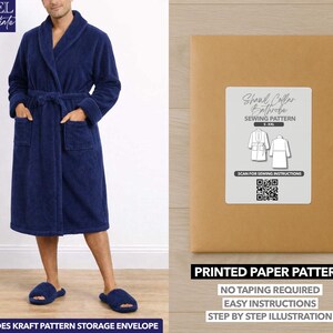 May include: A navy blue bathrobe with a shawl collar, pockets, and a matching belt. The image also shows a sewing pattern for a shawl collar bathrobe, with text that reads "Printed Paper Pattern" and "Easy Instructions."