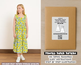 May include: A young girl wearing a sleeveless, yellow maxi dress with a lemon and blue floral pattern. The dress has ruffled trim and a square neckline. Next to her is a brown paper pattern envelope with a label that reads "GIRLS SQUARE NECK MAXI DRESS SEWING PATTERN".